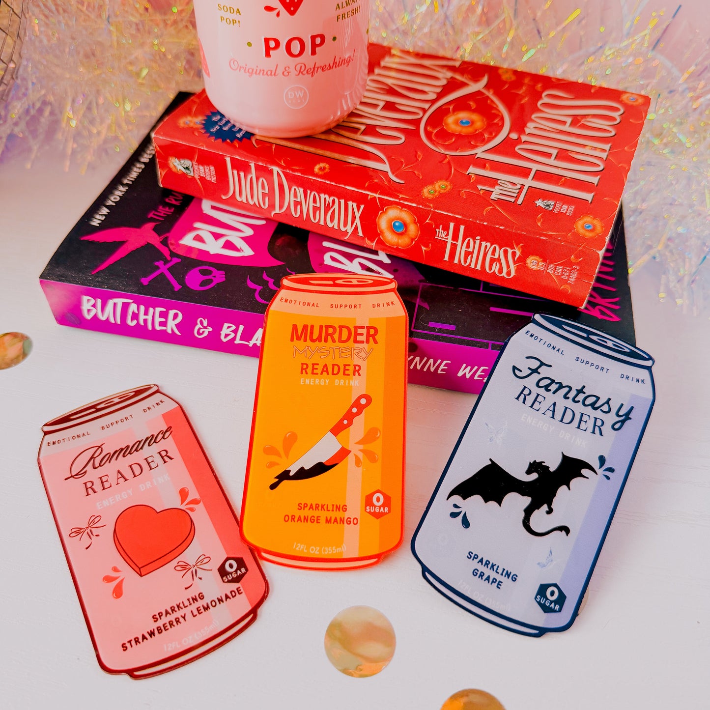 Assorted drinks with book-themed labels on a white surface.