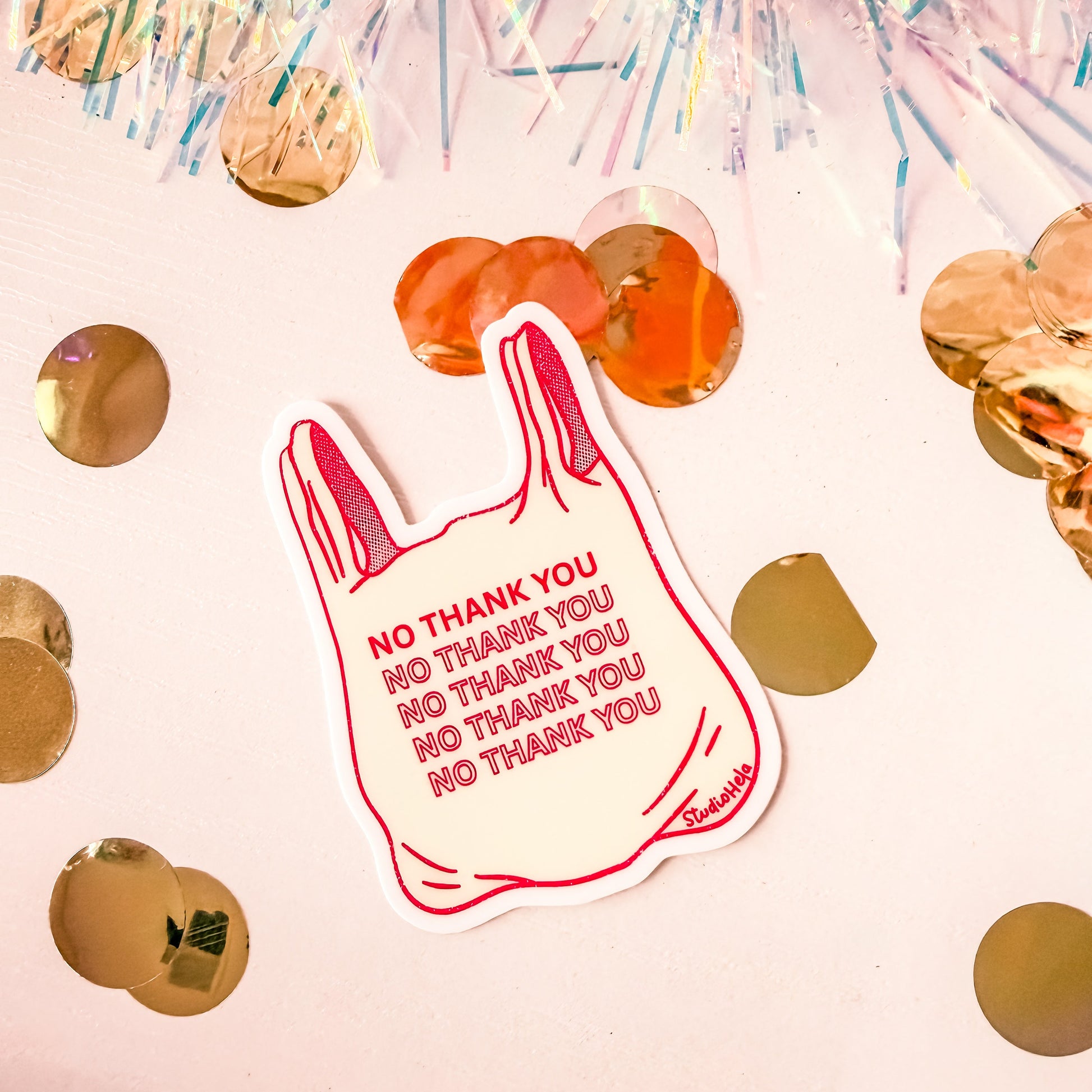 Sticker with 'NO THANK YOU' text on a pink background with confetti