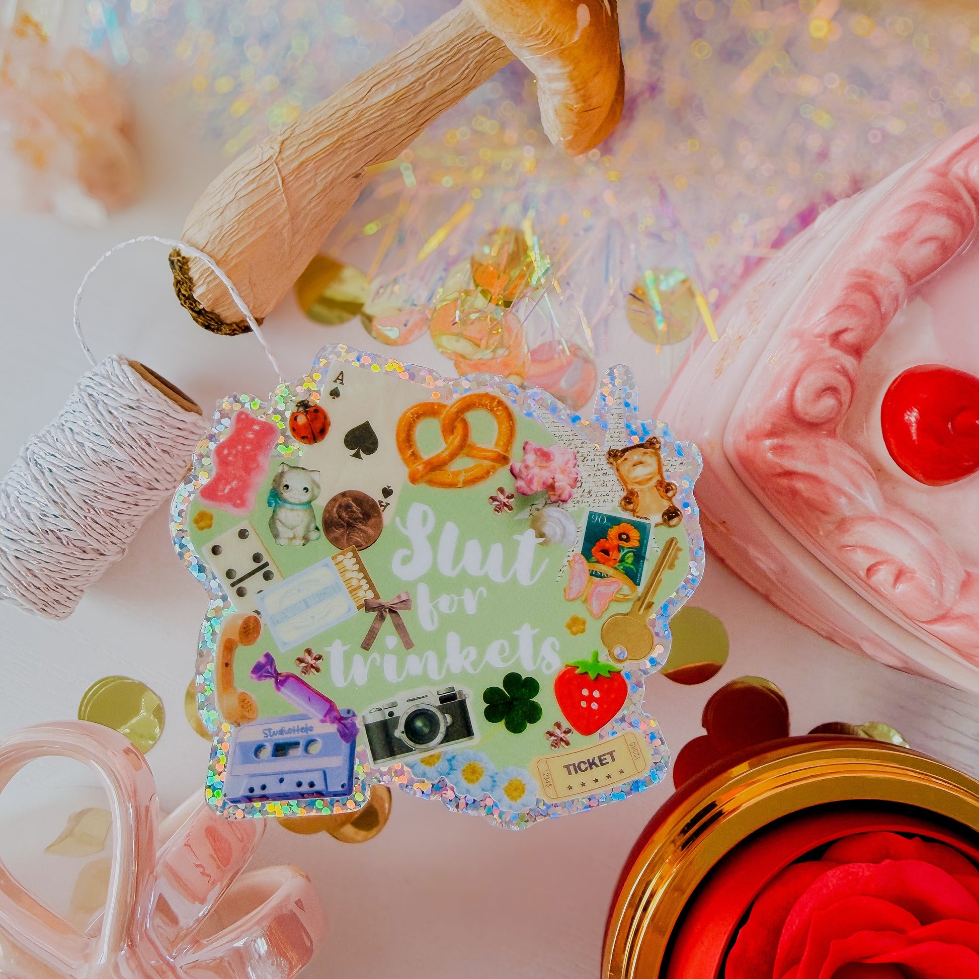Colorful sticker with text and graphics on a decorative background with mushrooms and flowers.