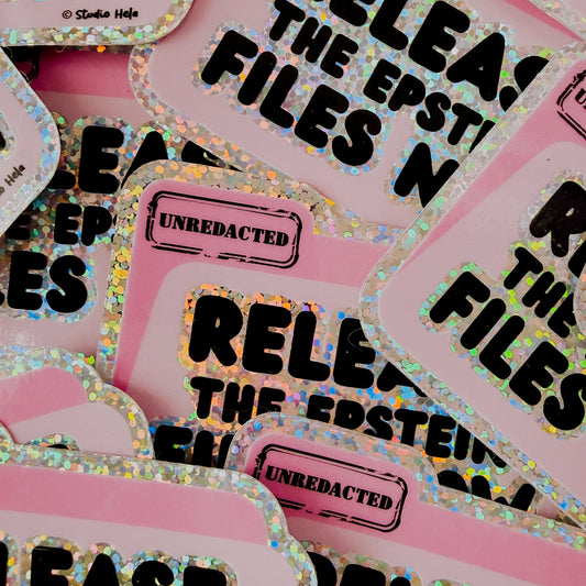 Stickers with text 'Release the Epstein Files' on a pink background
