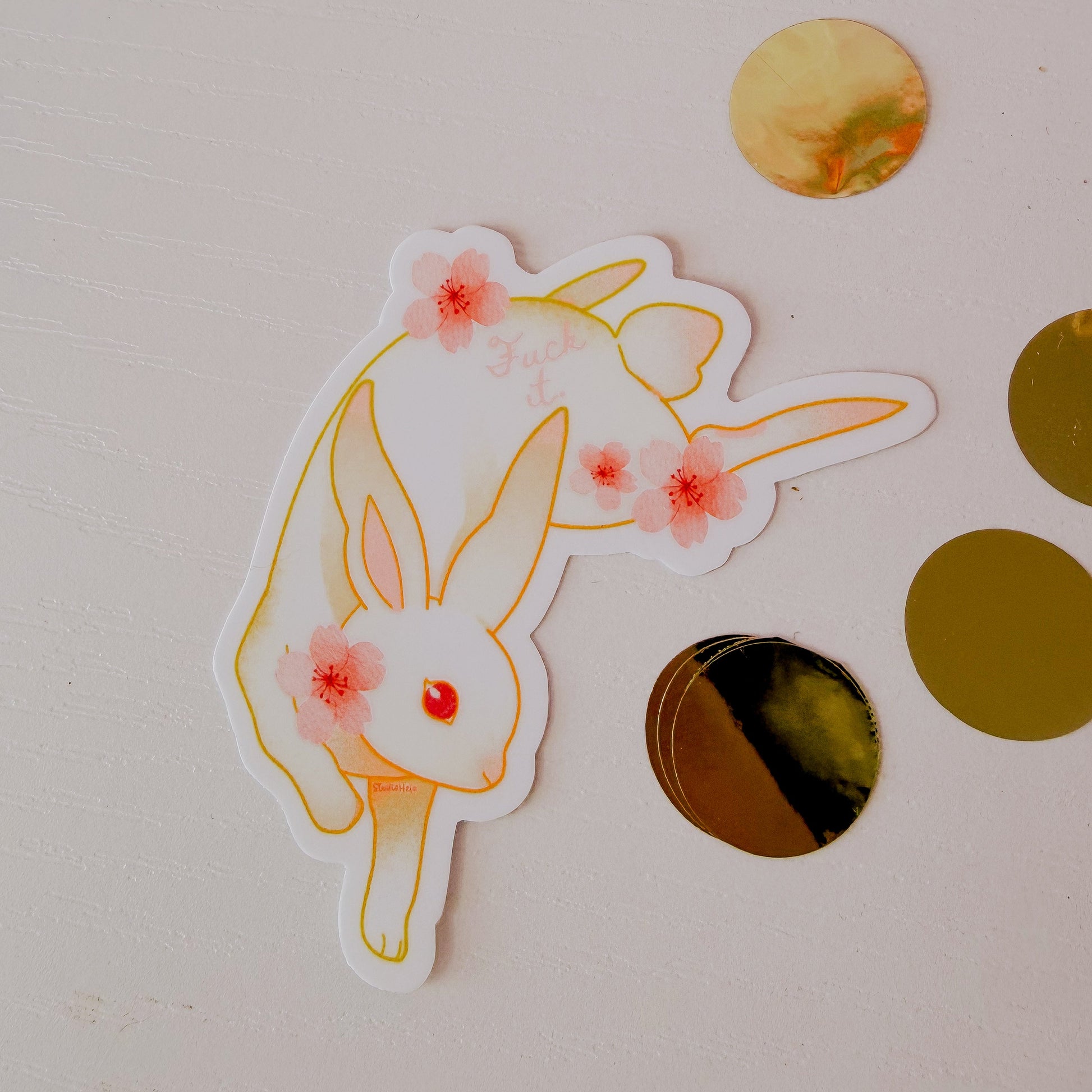 Sticker of a rabbit with flower ears on a light background